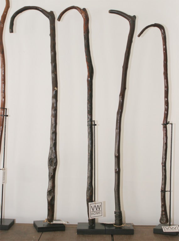 African Walking Sticks on stands. Each uniquely different in size, shape, and style. Highly decorative in groups or alone.  Available sizes vary from 36 1/6