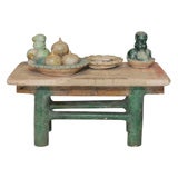 miniature earthenware table with offerings