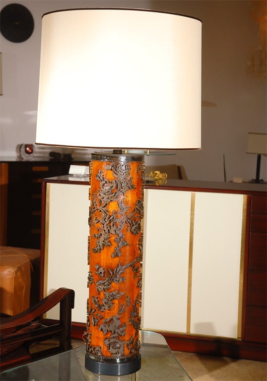 This old 1800's European wallpaper roller was made into a lamp in the early 1990's.  Hard wood and black painted brass.  The wood has a clear lacquer finish.  New cream shade with black trim.