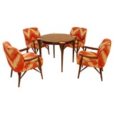 A Custom Game Table with Four Arm Chairs designed by Paul Laszlo