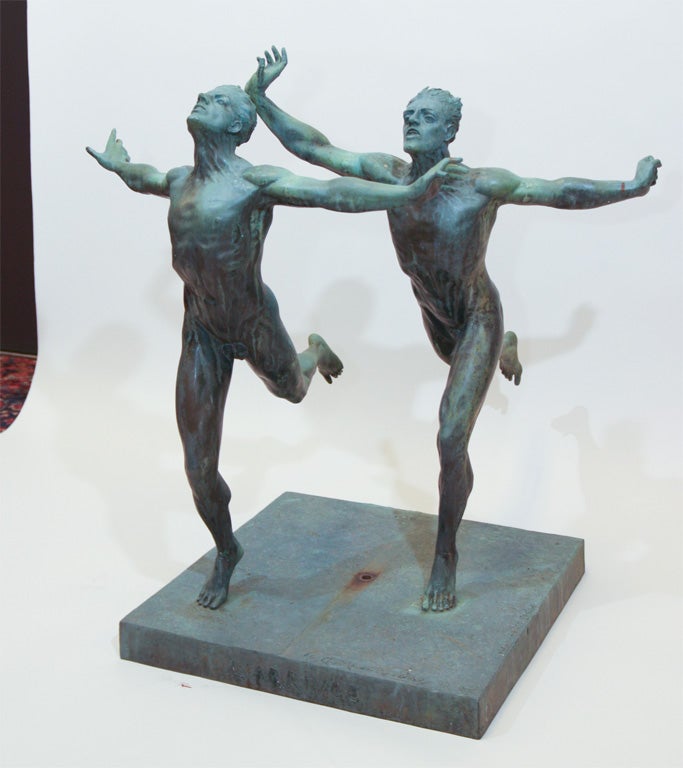 MARCEL GUIRAUD RIVIERE,'L' ARRIVEE'. A verdigris patinated bronze group of 2 nude males running with outstretched arms, incised signature and title.