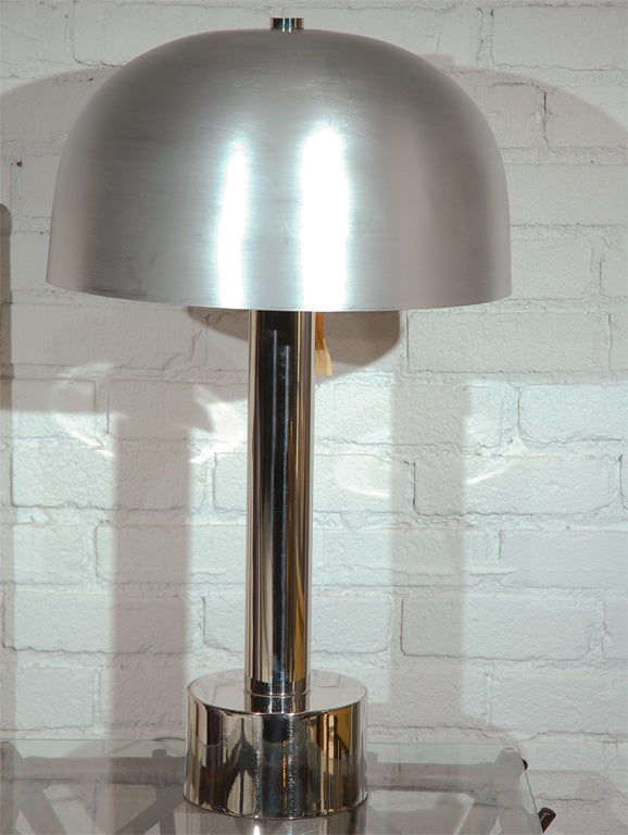Brushed aluminum shade and thick tubular chrome column and circular sturdy base. Expertly rewired and includes a new silver cord.