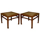 Pair of square elm tables with rattan tops.
