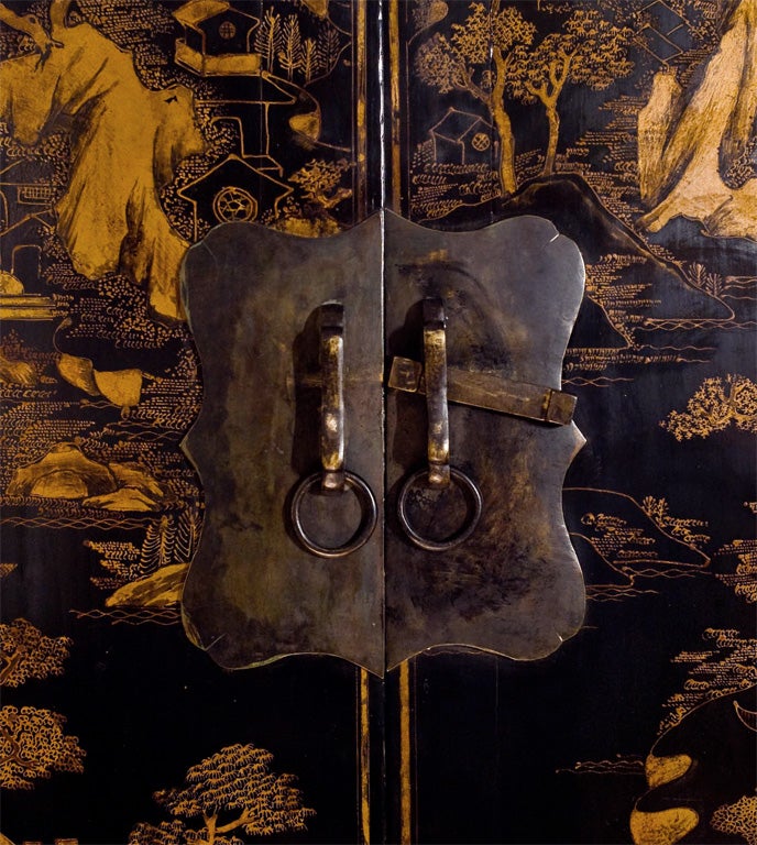 Chinese Tall gilded black lacquer compound cabinet.