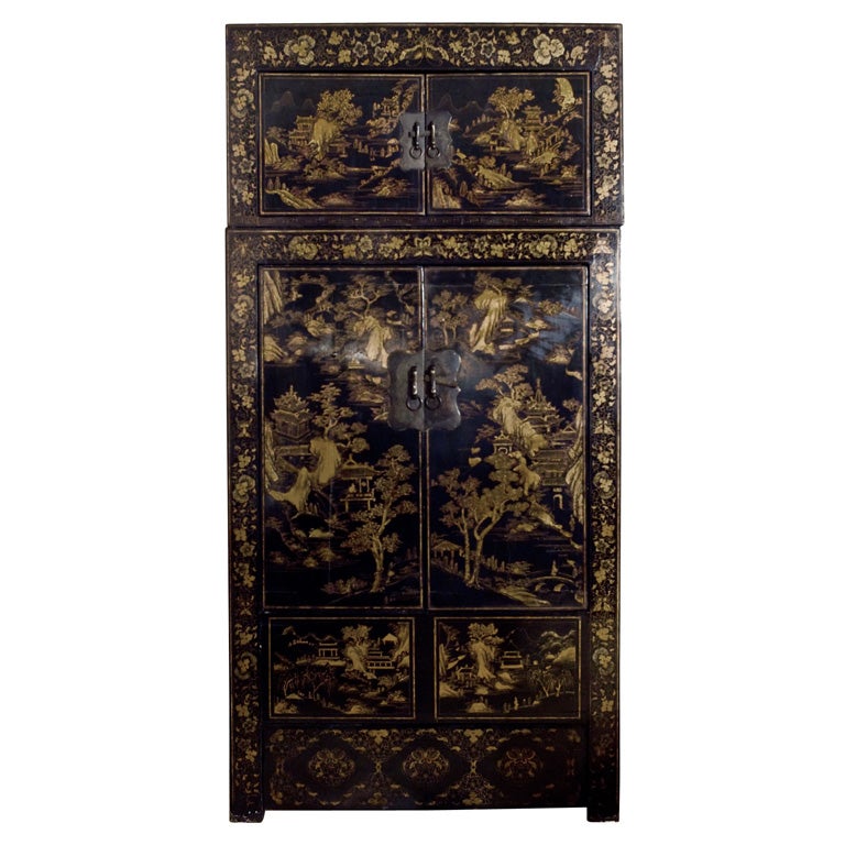 Tall gilded black lacquer compound cabinet.