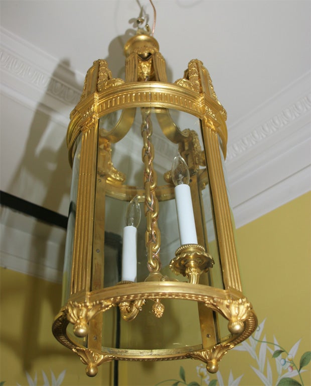 Fine Louis XVI style ormolu two-light cylindrical hall lantern, with four rounded glass panels. French, circa 1880.