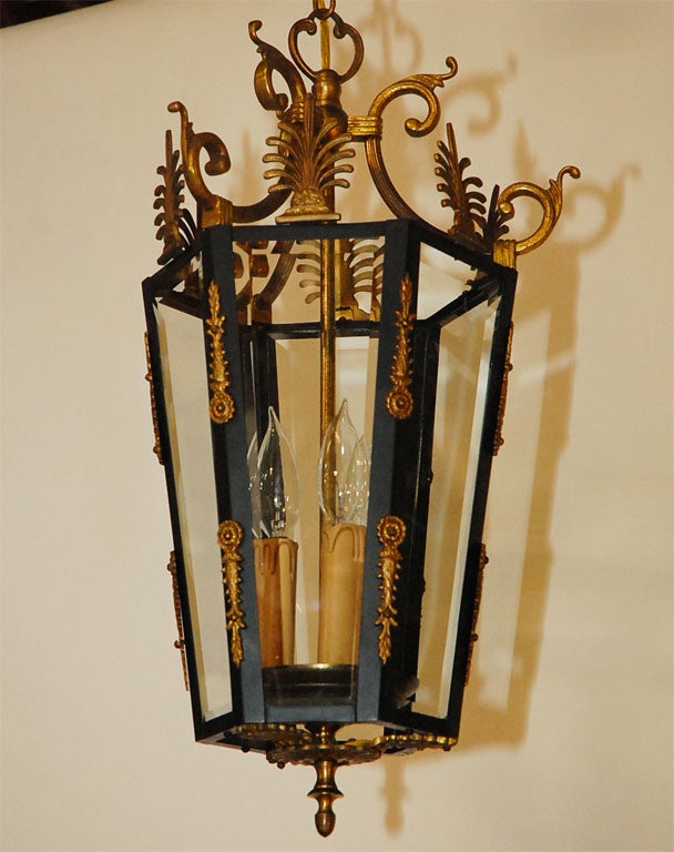This good quality stylish lantern has numerous detailed elements in cast brass. The three up-lights show most effectively through this six sided fixture. 