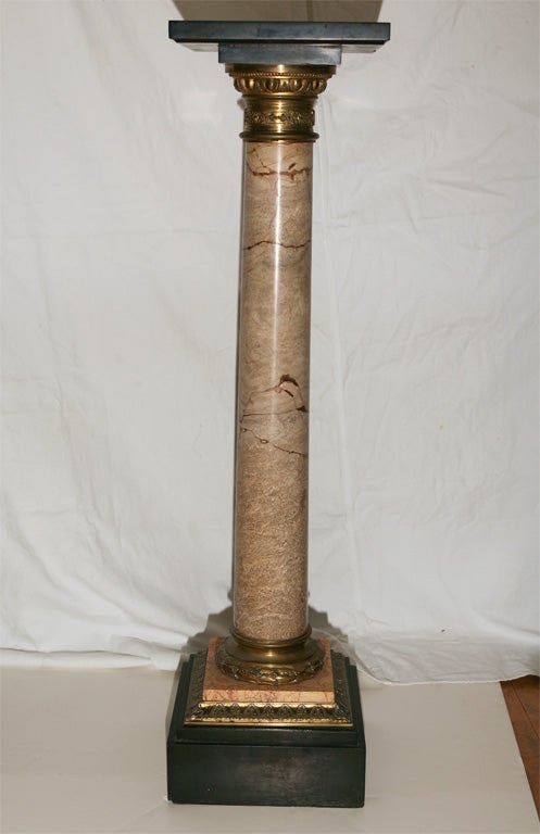 Marble and brass column pedistal with brass capital. Ideal stand for a sculpture or a plant.