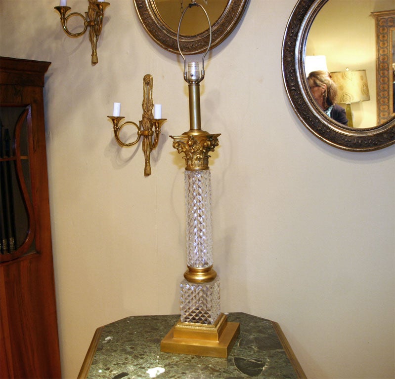 A 19th century large-scale, chunky Baccarat cut crystal converted oil columnar table lamp with bronze Corinthian capital and base.