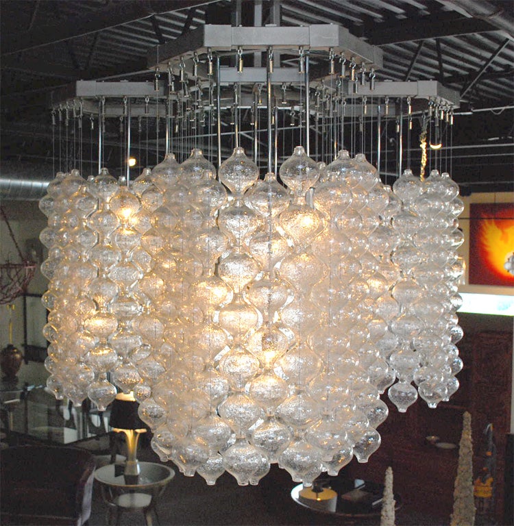 Exceptional chandelier with over five hundred seperate kalmar  glass ball elements. The large metal frame structure supports the simply strung connecting glass ball elements which makes this a breath taking chandelier. the chandelier was acquired