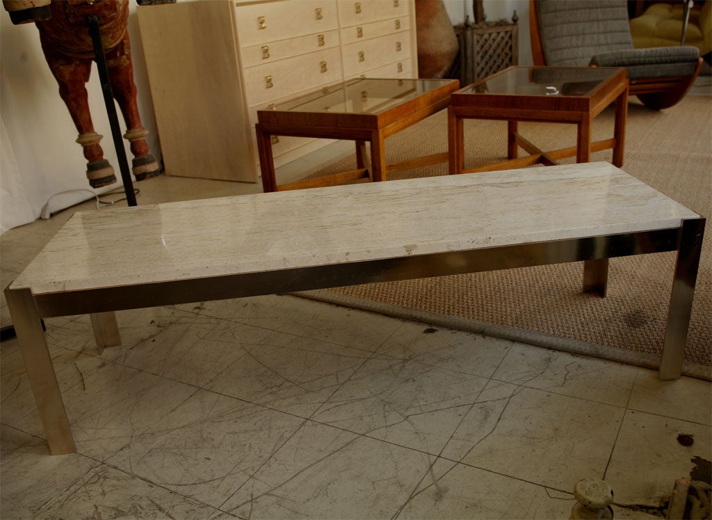 Chrome base table and filled travertine top