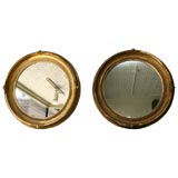 Antique Pair of Mirrors in Round Gilded Frames.