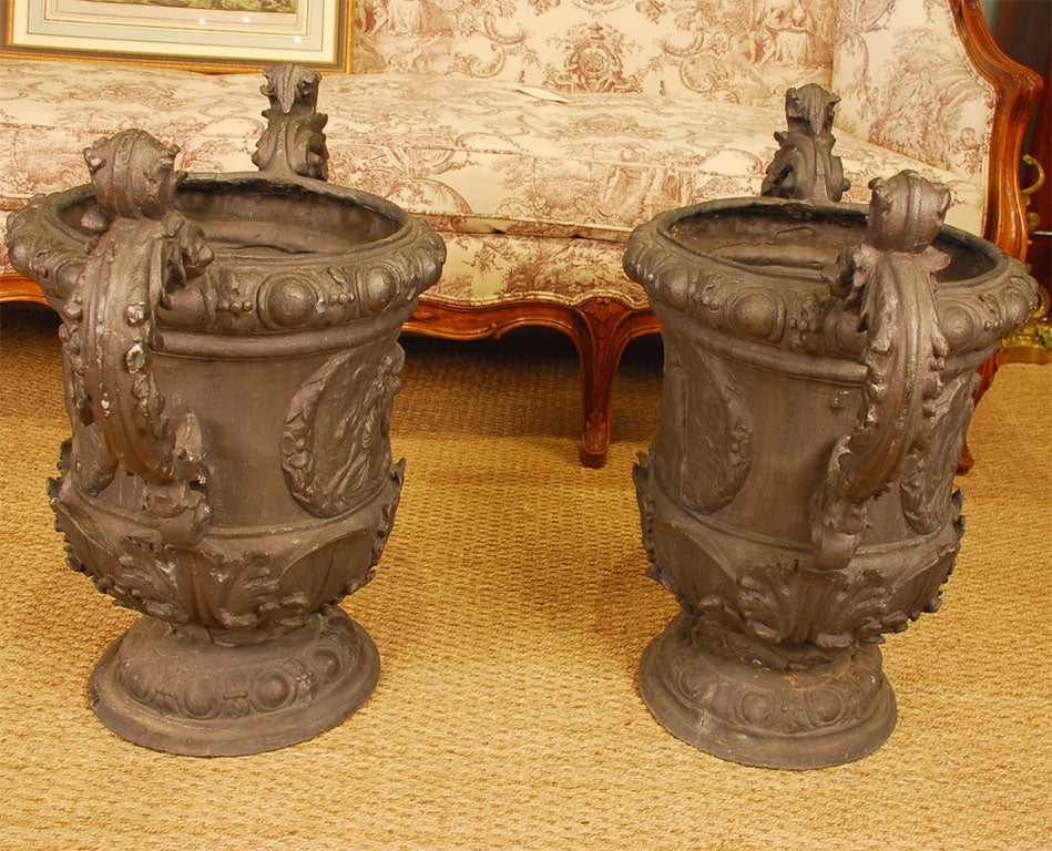 Neoclassical Pair of Continental Lead Urns For Sale