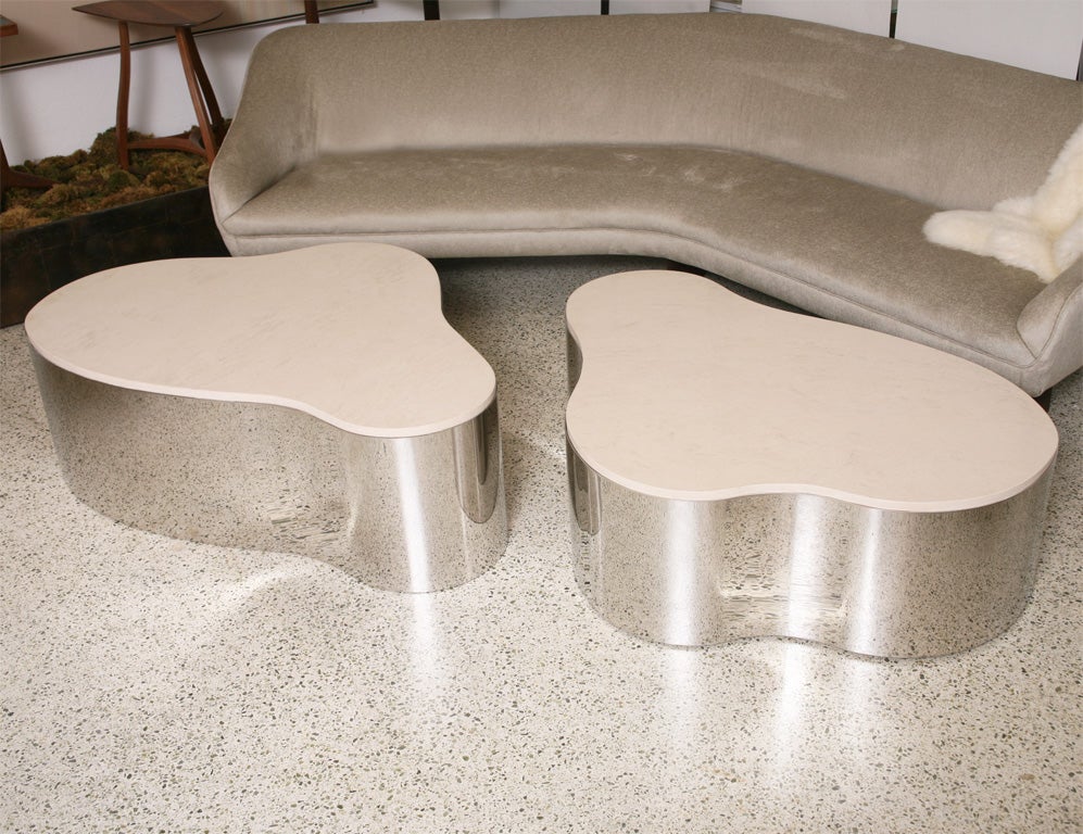 Pair of Karl Springer freeform tables,<br />
New travertine stone tops,(tables will<br />
come with original black glass tops as well )<br />
 steel base