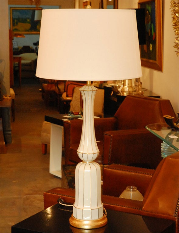 Large pair of Lenox porcelain Column on plinth form table lamps with 22 carat gold overlayed striping on gilt wood base.
