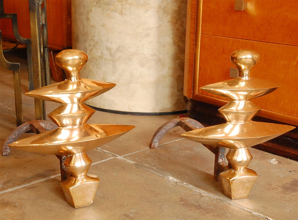 Pair of Limited edition reproduction Diego Giacometti polished brass andirons commissioned by Nelson Rockefeller after the original pair from his 5th Avenue apartment designed by Jean-Michel Frank.  Stamped 