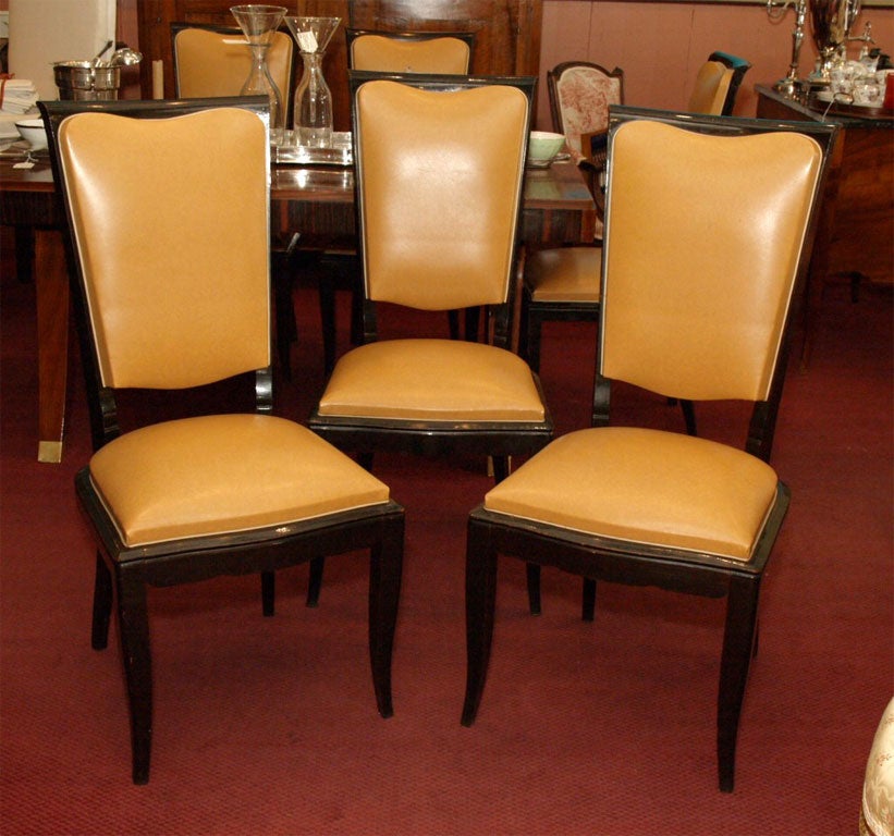 Set of six French Art Moderne ebonized dining chairs, circa 1930, covered in skaii - fake leather