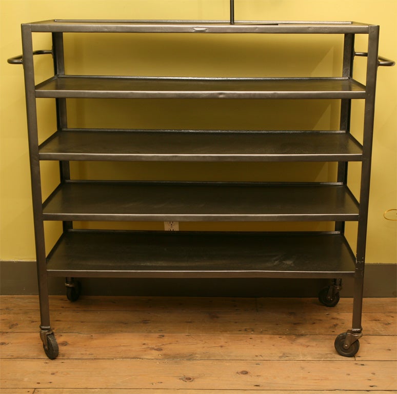 Large and Heavily Constructed Industrial Shelving Unit on Casters. Ideal storage or display for  books or magazines