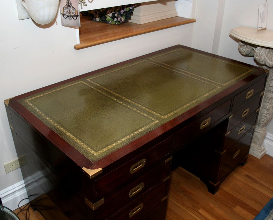 19th Century An English mahogany campaign style knee hole desk