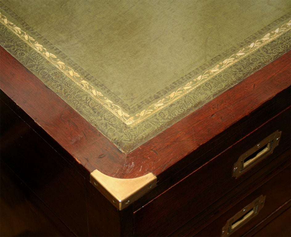 An English mahogany campaign style knee hole desk 1