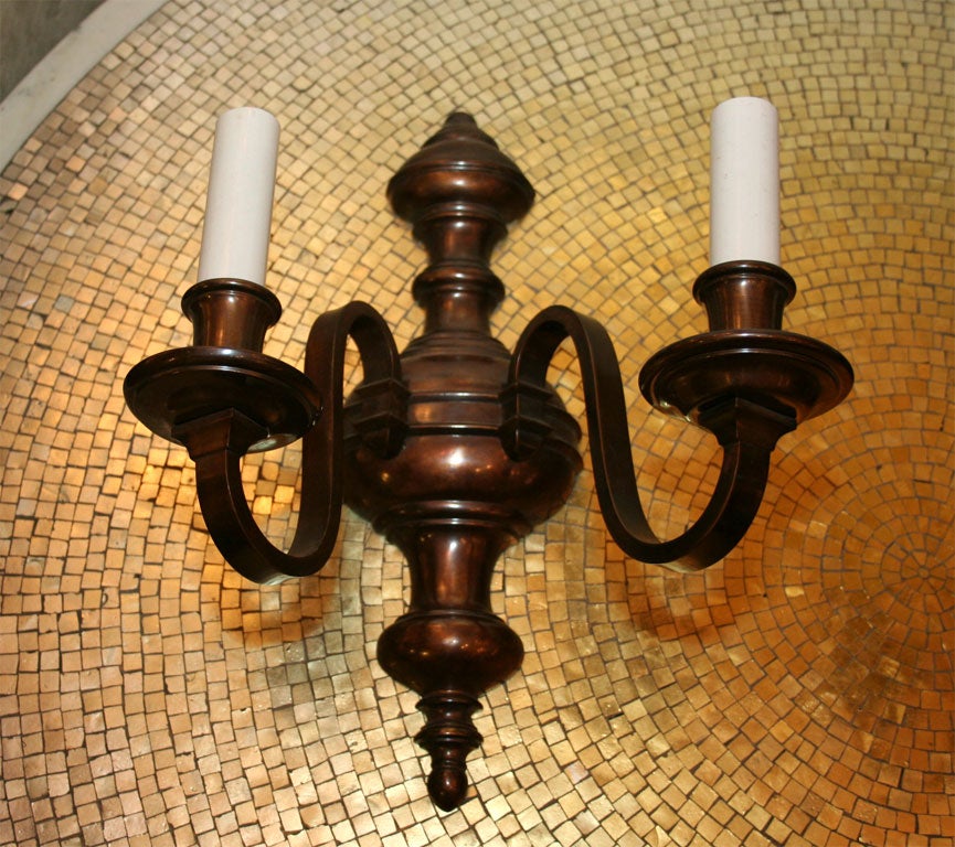 Four American Baroque style patinated bronze two-light sconces