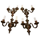 Four American Baroque style patinated bronze two-light sconces