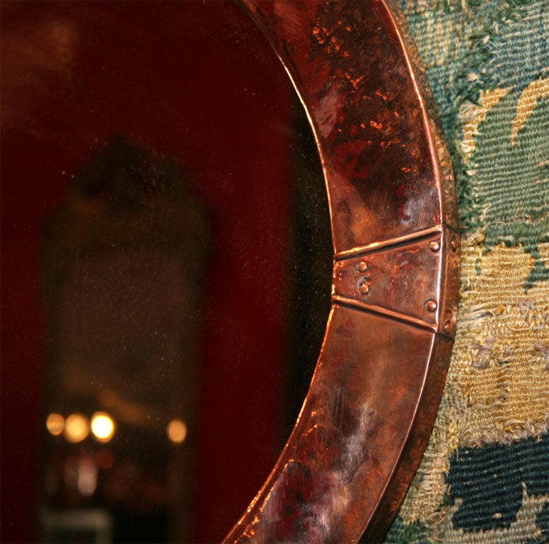 An English Arts & Crafts Oval Copper Mirror