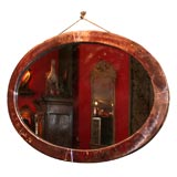 An English Arts & Crafts Oval Copper Mirror