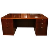 Large mohgany executive desk with brass plated handles.