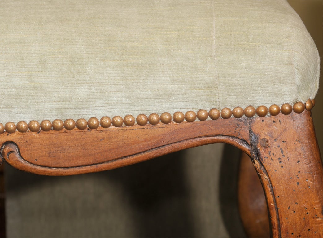 Grand scale 18th century French Louis XV upholstered walnut banquette with gracious carved detail. Versatile piece. Would work great at the end of a bed.

Please click KIRBY ANTIQUES logo below to view additional pieces from our vast inventory.
