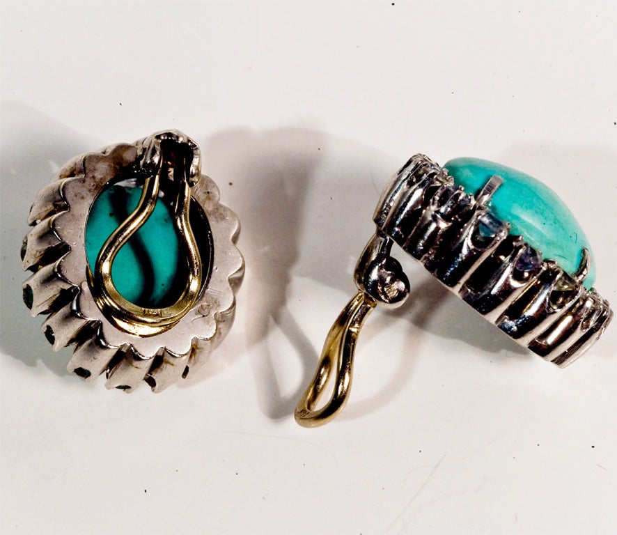 Fabulous set of Persian turquoise earrings 14kt white gold. Both earrings circled by white sapphires.