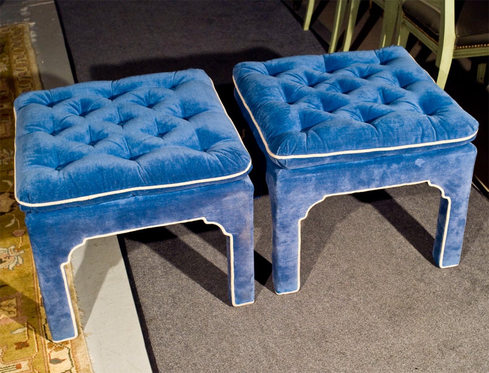 Pair blue velvet with white border design upholstered mid century ottomans. The tops button tuffted. Fine Quality.