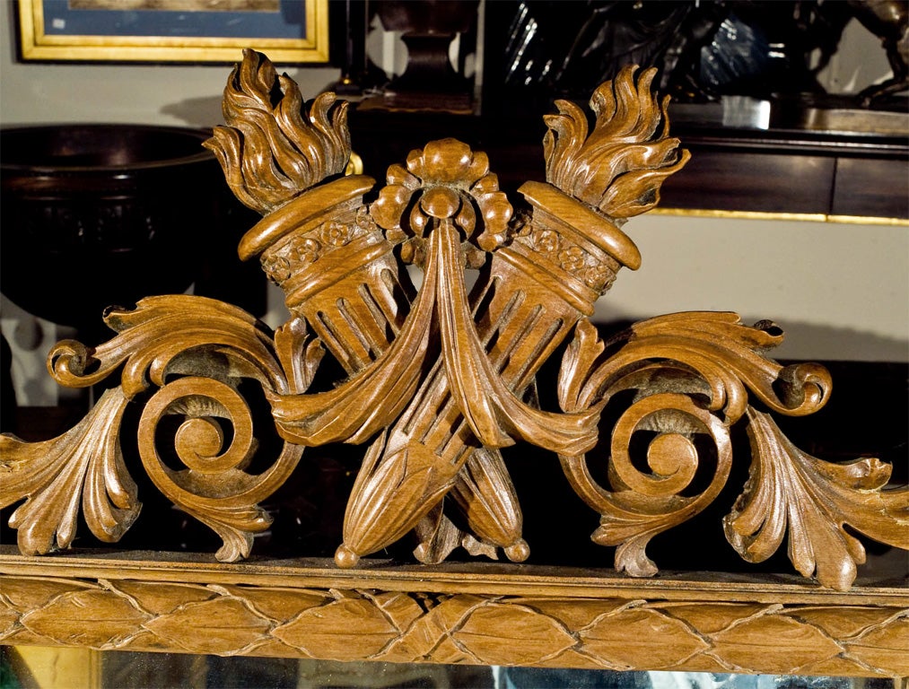 hand carved fruitwood mirror in the transitional Roccoco to Neo-Classic style. deeply carved with  wonderful detail