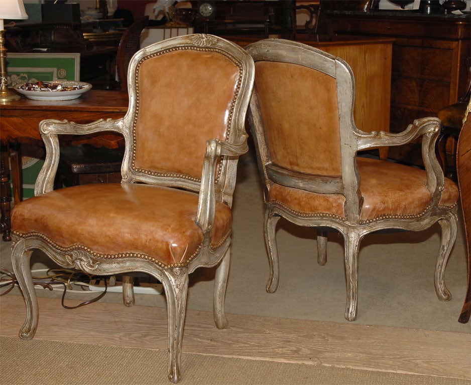 A pair of Venetian silver gilt armchairs 1