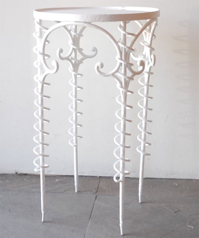 Sculptural painted iron table with vintage white glass.
Visit the Paul Marra storefront to see more furnishings and lighting including 21st Century.