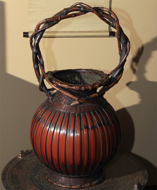 Spectacular Japanese Hana kago (flower basket) of unusual size. Crafted of split bamboo old baskets of this size are very unusual. The bamboo lips and twisted handles are made from bamboo rhizomes or bamboo roots that are manipulated to grow a