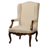 French wing chair with detailed carving, circa 1870