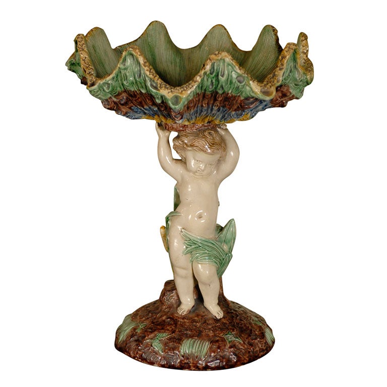 French Majolica cherub with shell compote, circa 1840