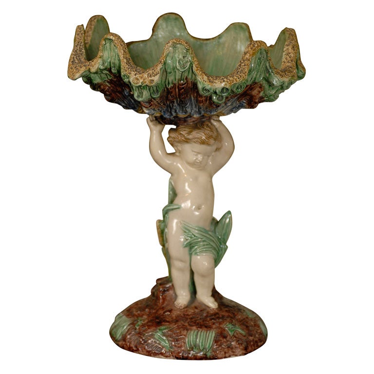 French Majolica cherub with shell compote, circa 1840