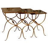 French gilt iron nesting tables with intaglio design on glass