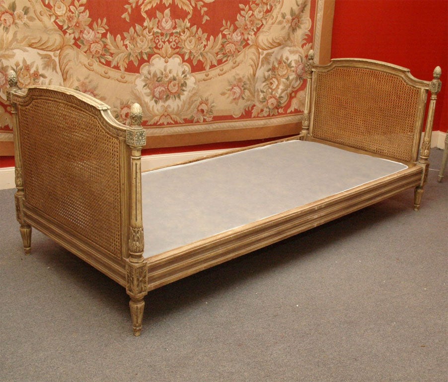 painted doubled caned daybed in the Louis XVI style with new custom platform base and mattress. The bed measures 79