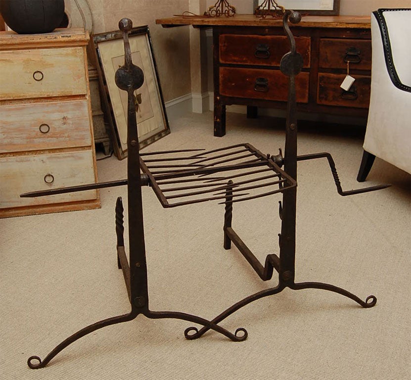Rare pair of cast iron signed and dated andirons with rotisserie spit. The andirons are signed D.A. Court and dated 1872.