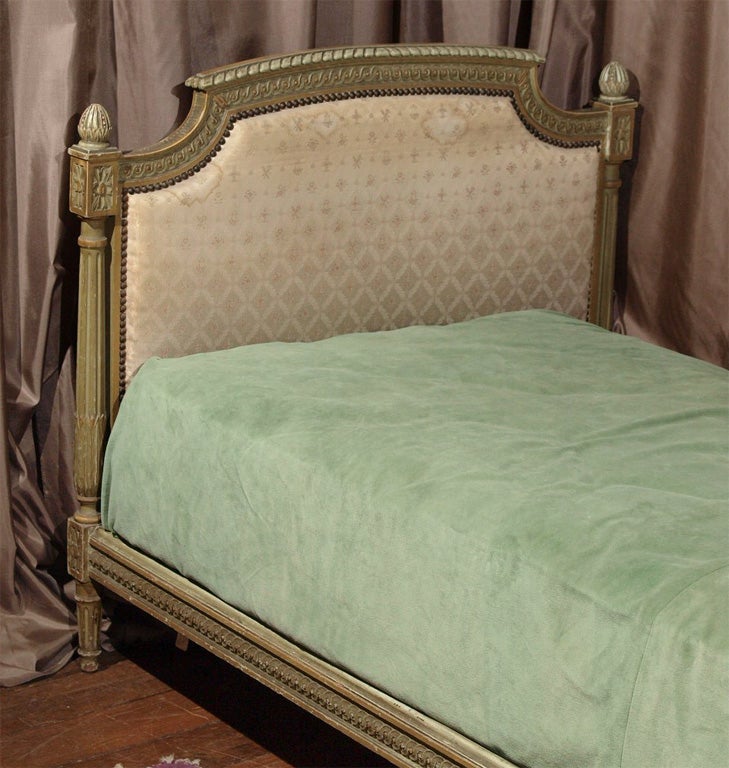 Carved and painted in greens and golds.  Attractive wear to original finish.<br />
Requires custom mattress or cushion.<br />
<br />
Interior meausres:  75 1/2” x 36”