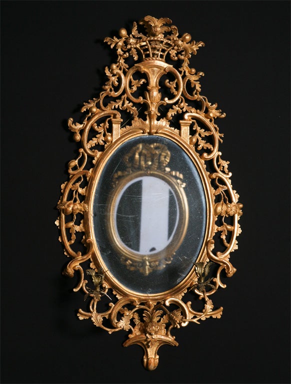 A good pair of 19th century portrait mirrors with sconces.
