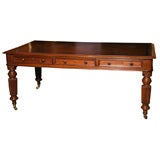 An English antique 6 drawer writing table in mahogany.
