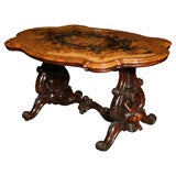 A magnificent English inlaid center table.