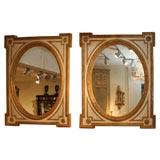 A Pair of Neoclassical Creme Painted Parcel Gilt Mirrors