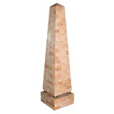 Pair of stone veneer obelisks