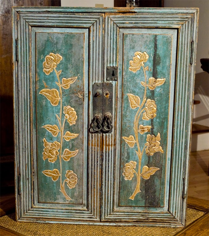 Small painted cabinet with gilt floral painting in front 2