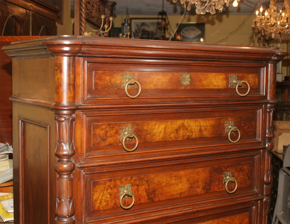 A very fine antique American walnut and burl walnut tall 7 drawer chest.